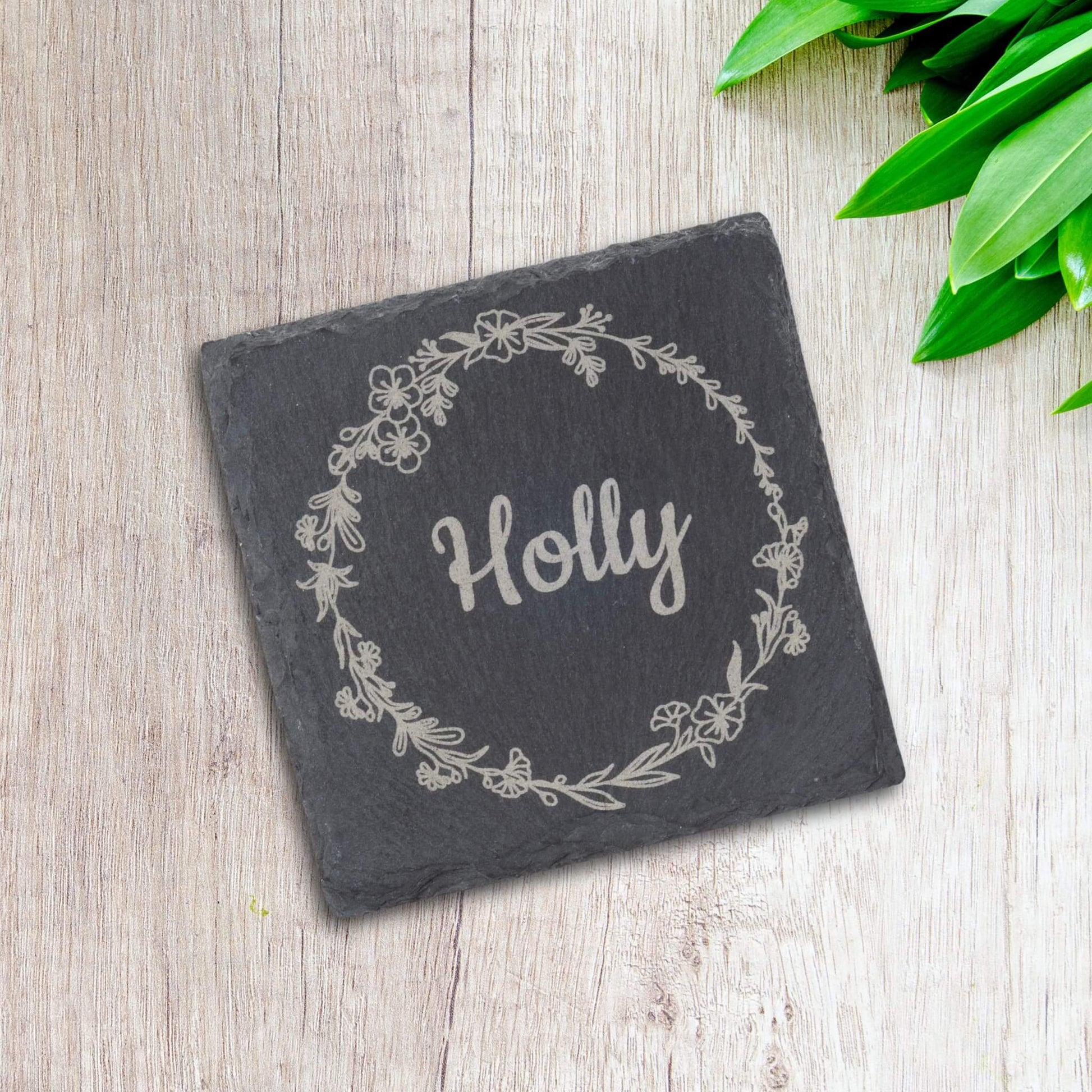 Personalised Slate Coaster for a Special Person featuring the name 'Holly' inside a floral wreath design.