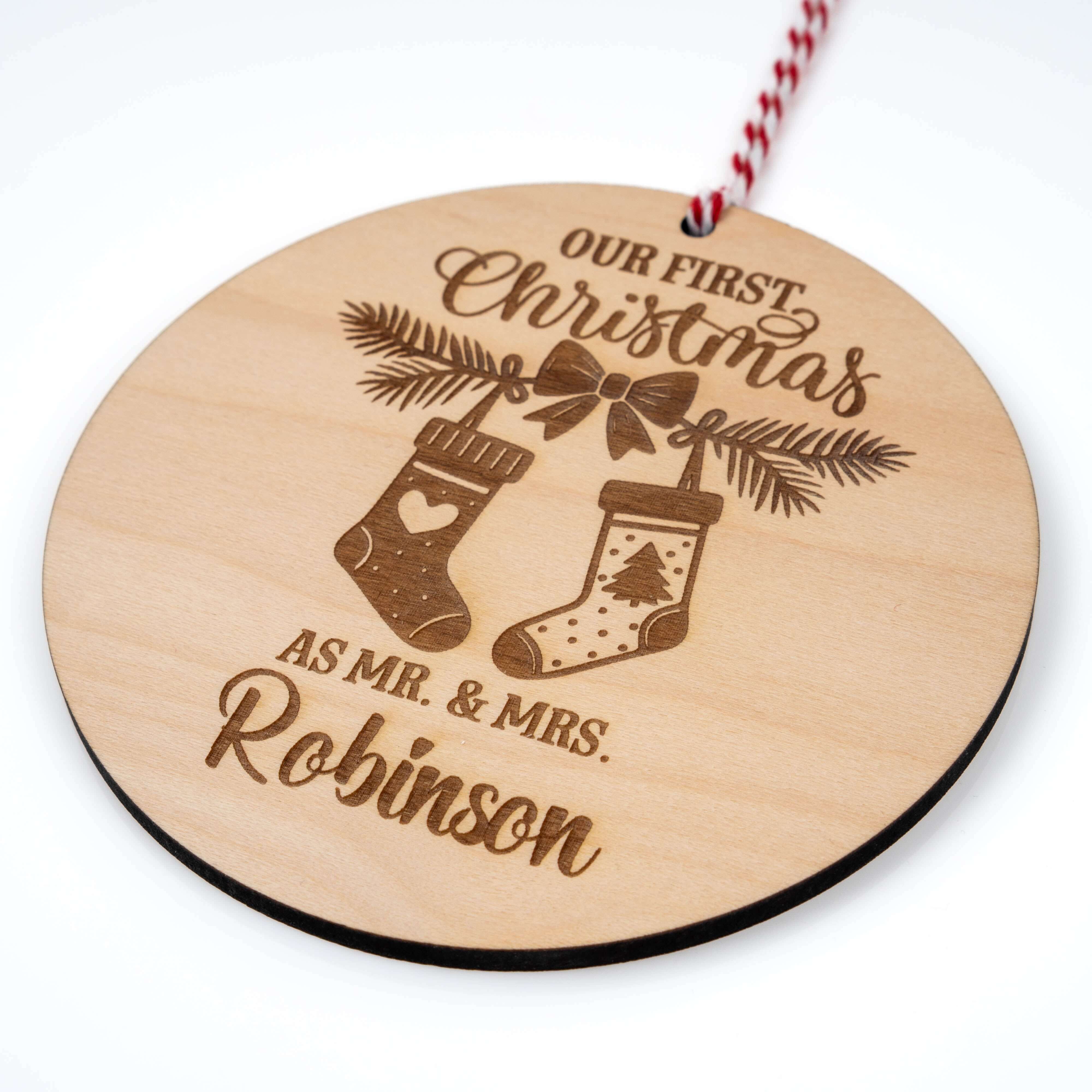 Personalised Couples Christmas Ornament - Wooden Tree Bauble featuring stockings and names on natural maple.
