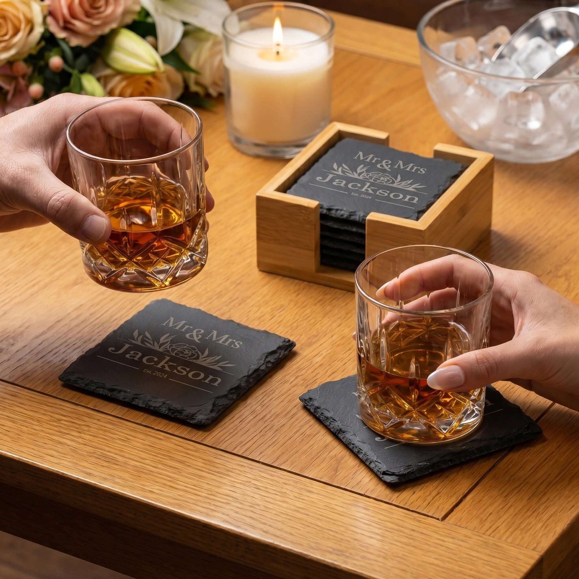 Personalised Slate Coaster Set with Holder featuring engraved names, perfect for Mr & Mrs wedding gift on a stylish dining table.