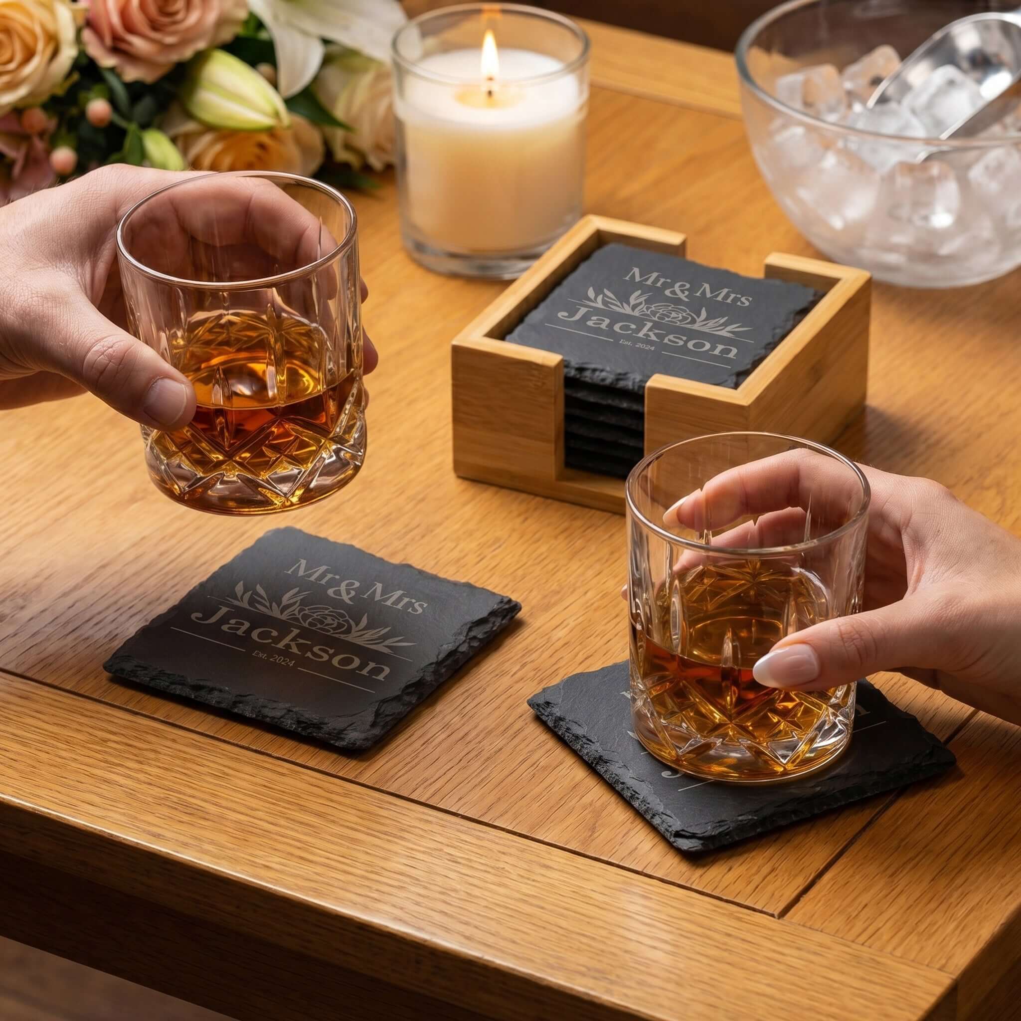 Personalised Slate Coaster Set with Holder featuring engraved names, perfect for Mr & Mrs wedding gift on a stylish dining table.