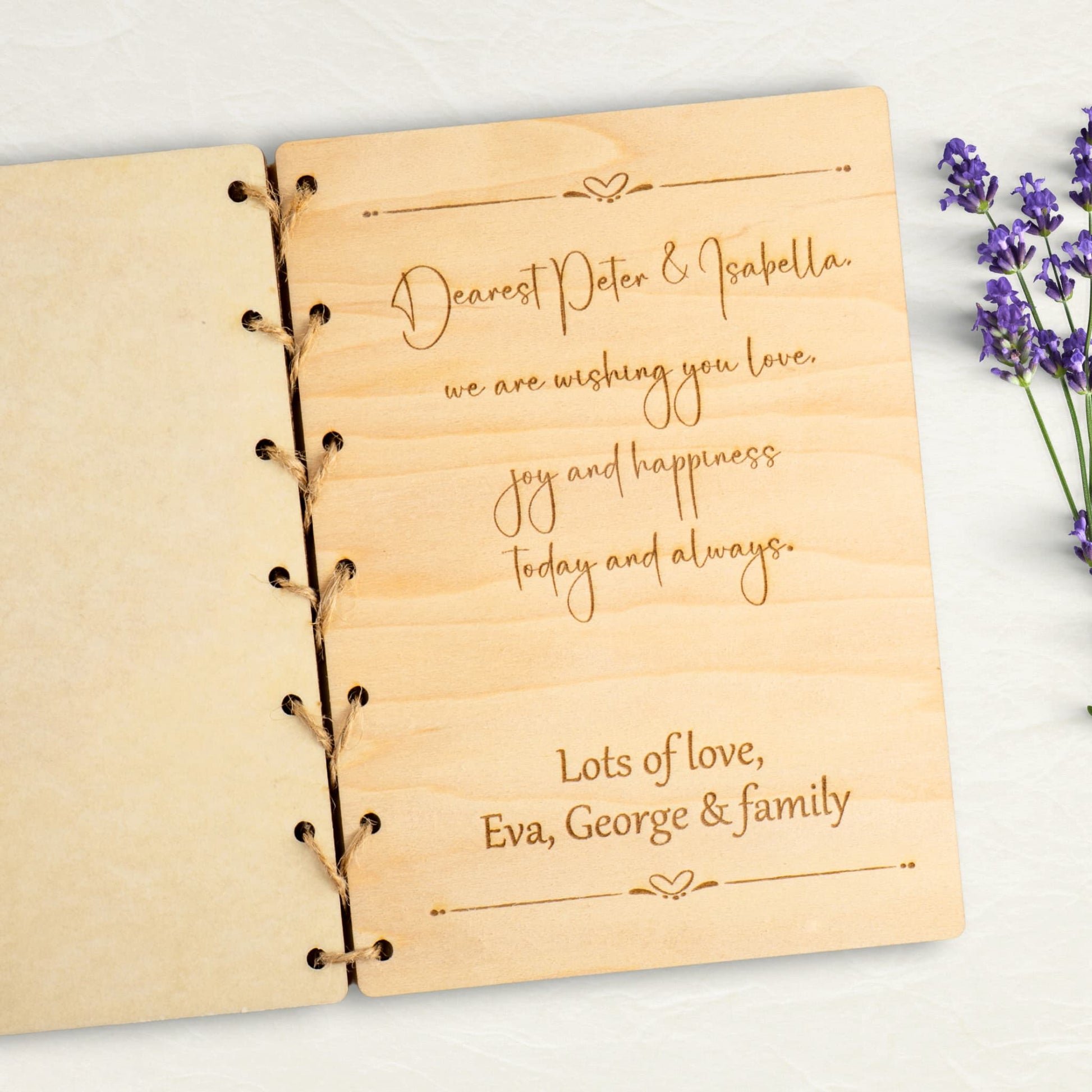 Personalised wedding card featuring engraved message for couple on wooden material.