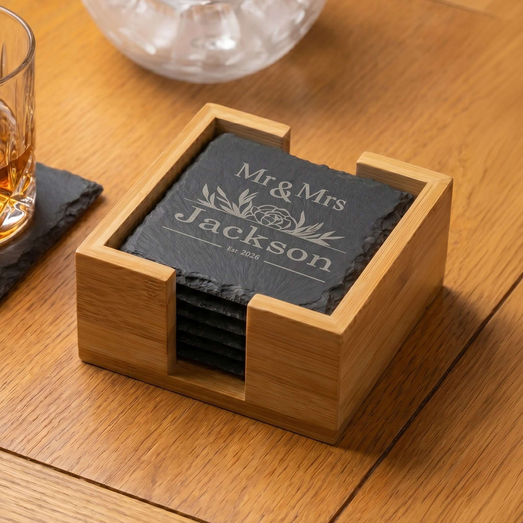 Personalised Slate Coaster Set with Holder featuring engraved Mr & Mrs design on natural slate coasters in bamboo holder.