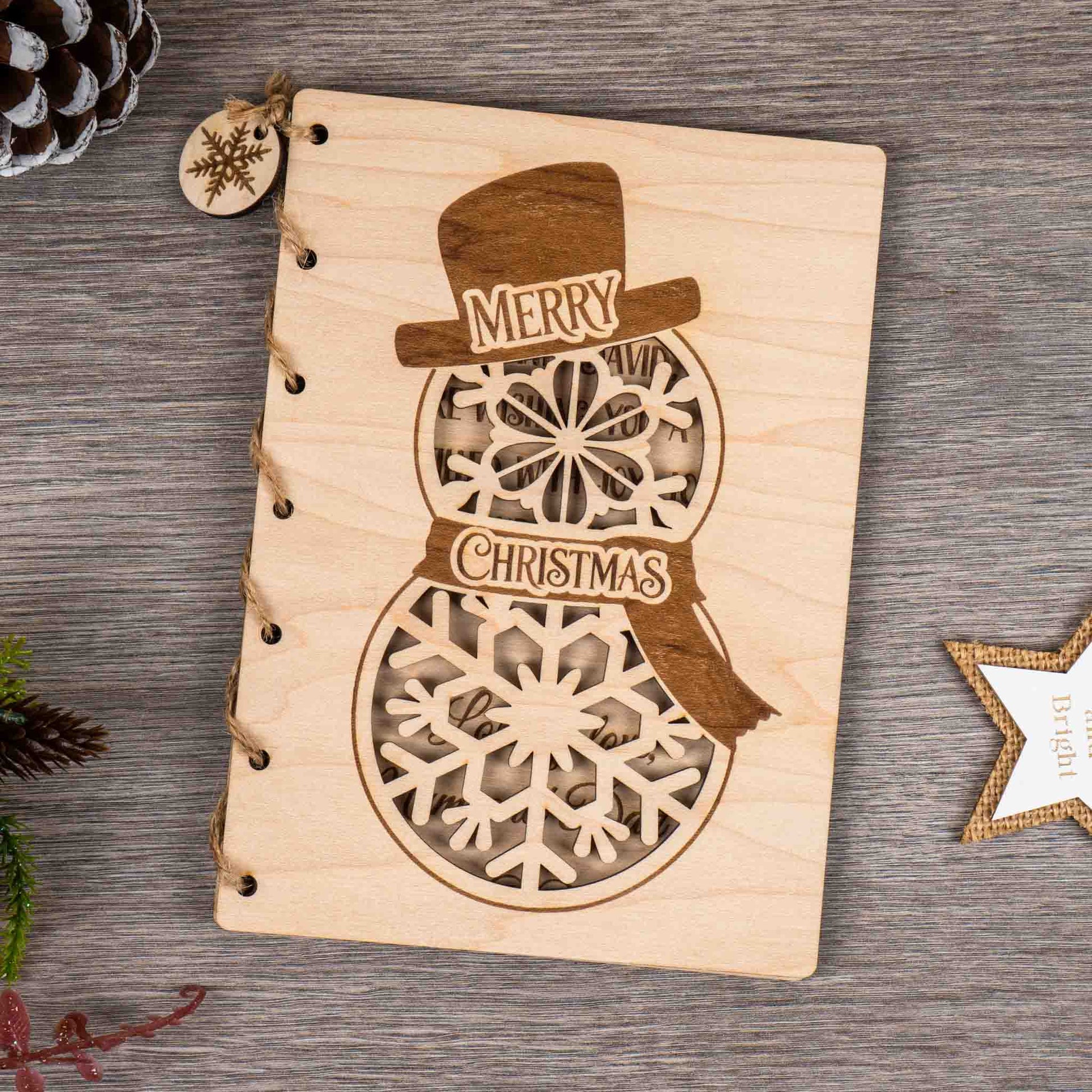 Personalised Christmas Card featuring an engraved snowman design with the words 'Merry Christmas'.