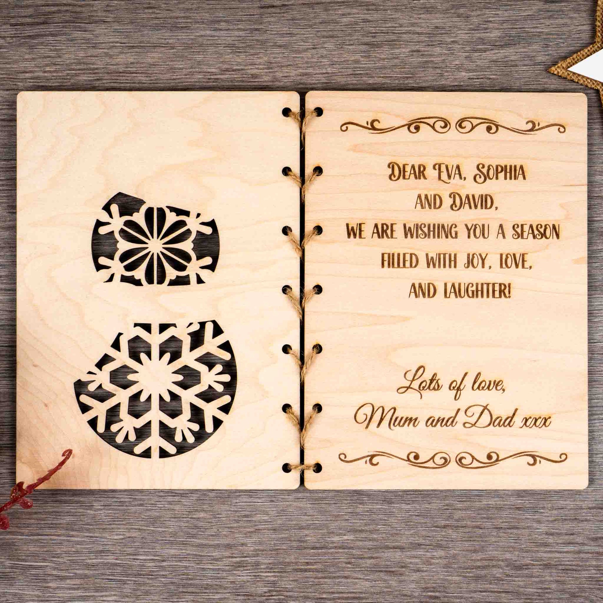 Personalised Christmas Card featuring engraved snowman design and festive message for a heartfelt holiday greeting.