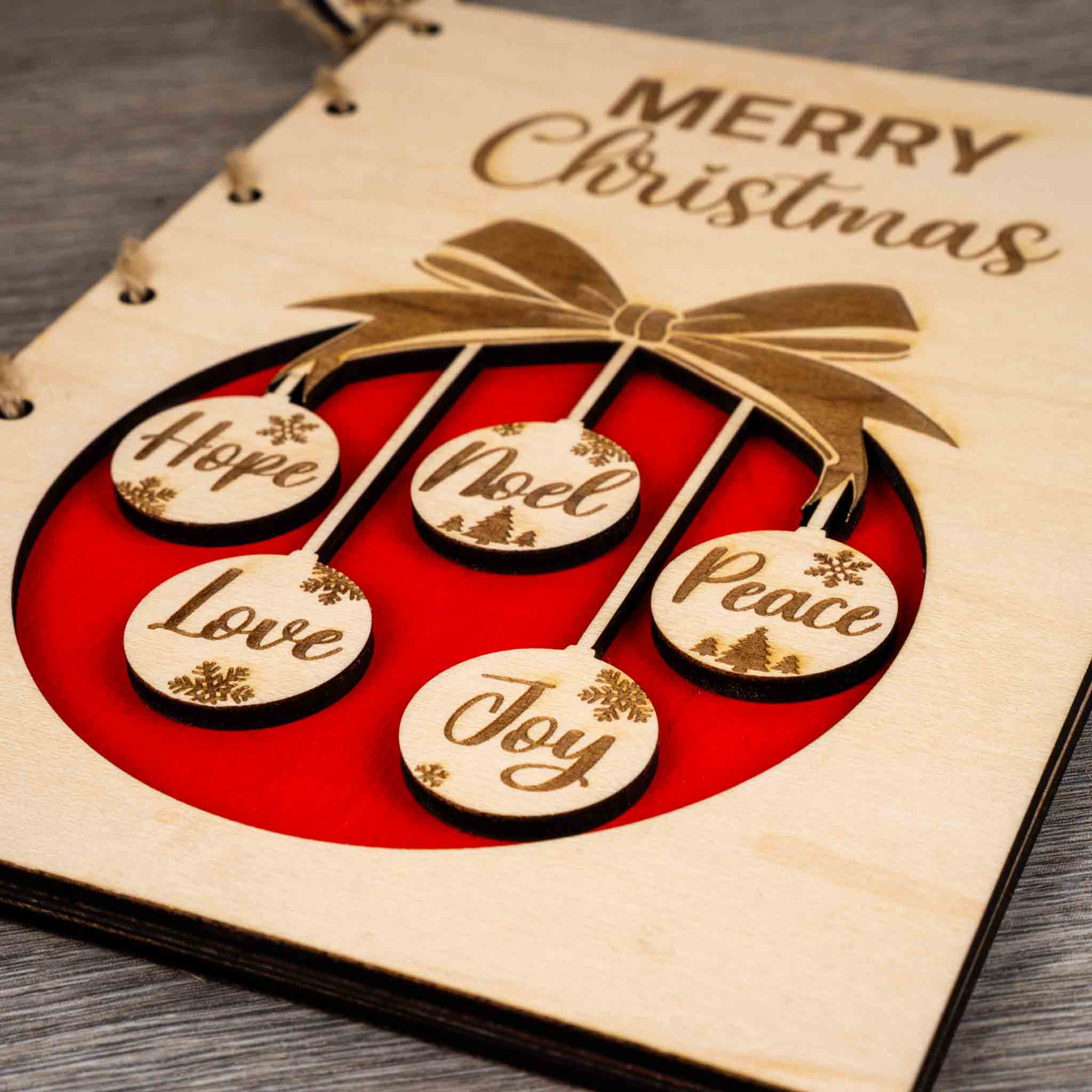 Personalised Christmas Card featuring engraved ornaments with messages of Hope, Noel, Love, and Peace.