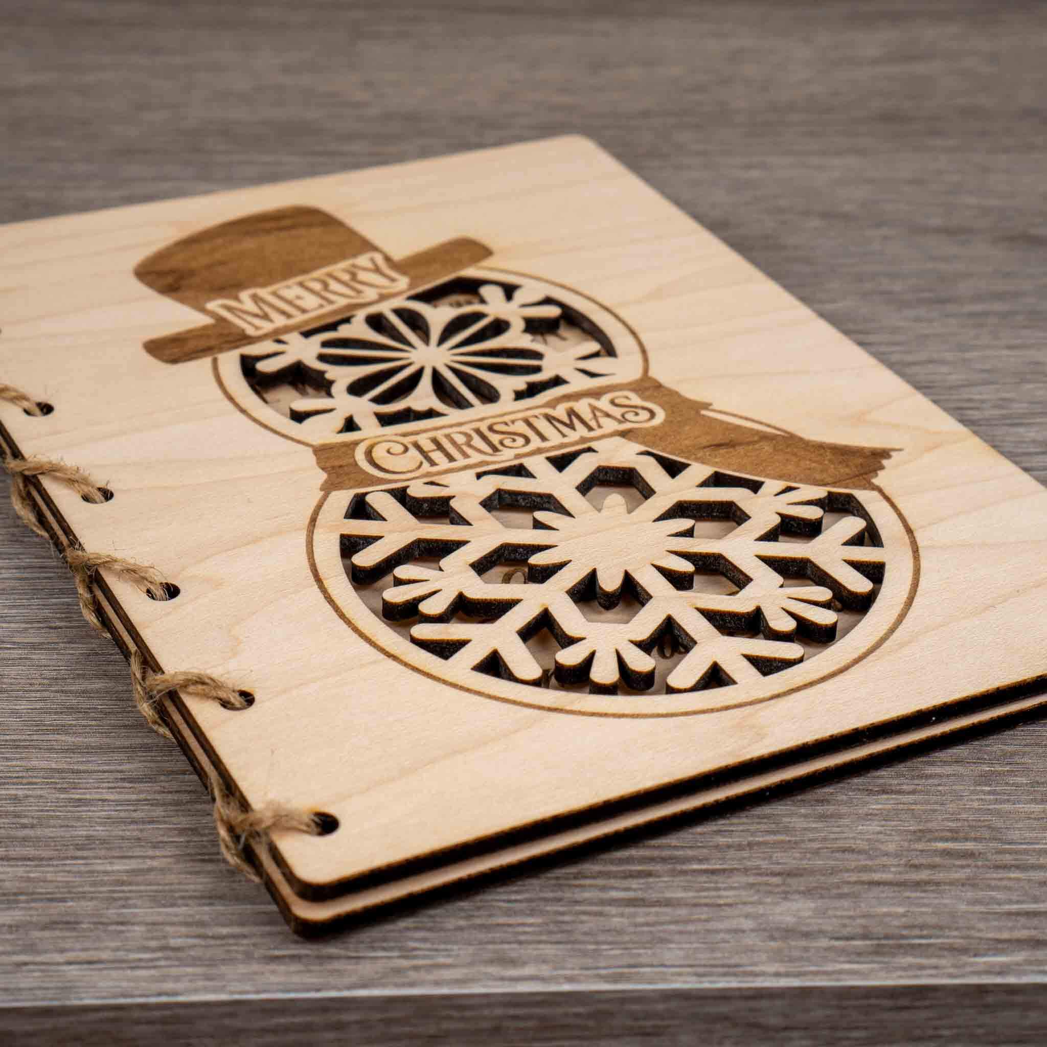 Personalised Christmas Card featuring an engraved snowman design with snowflakes and Merry Christmas message.
