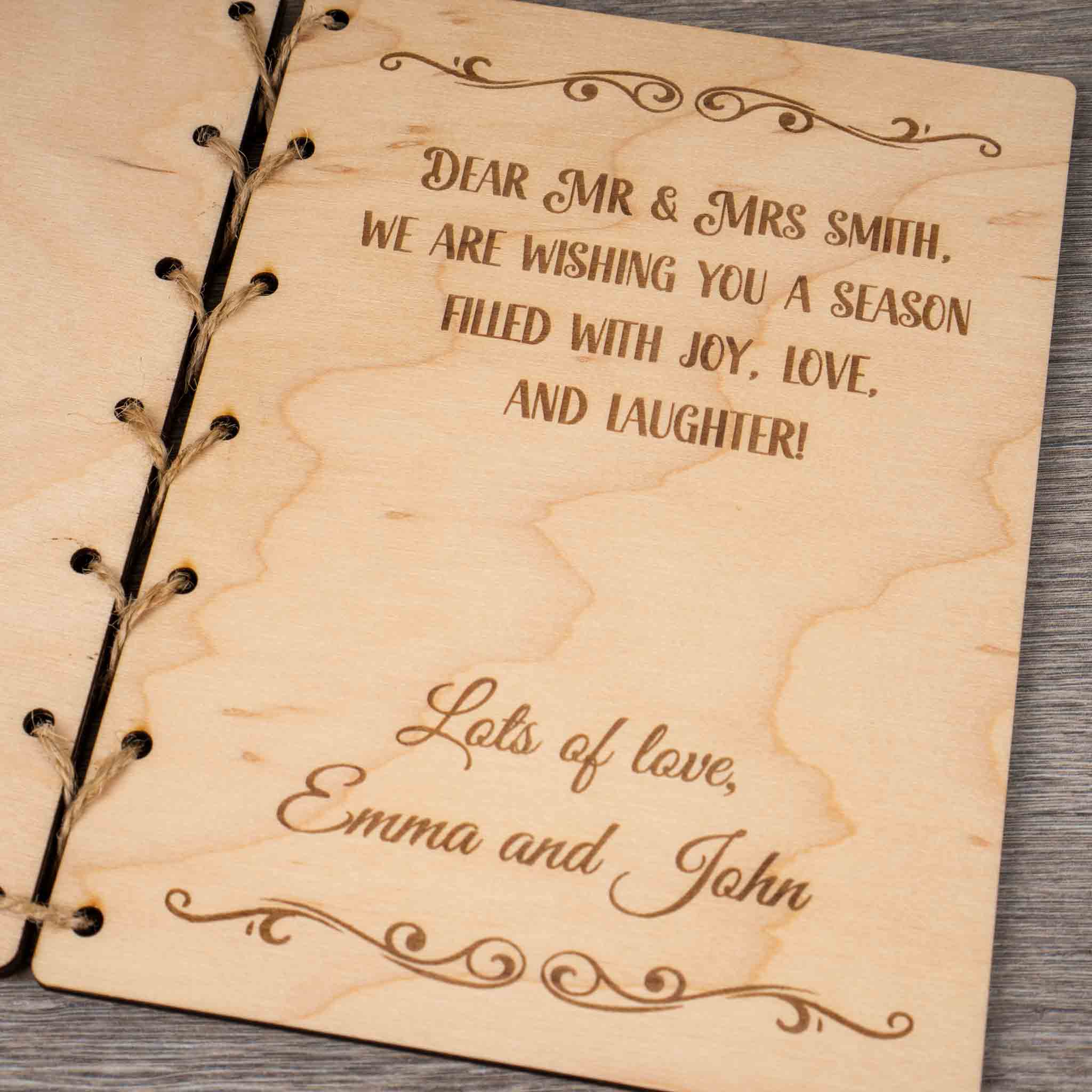 Personalised Christmas Card featuring heartfelt engraved message for Mr & Mrs Smith and lots of love from Emma and John.