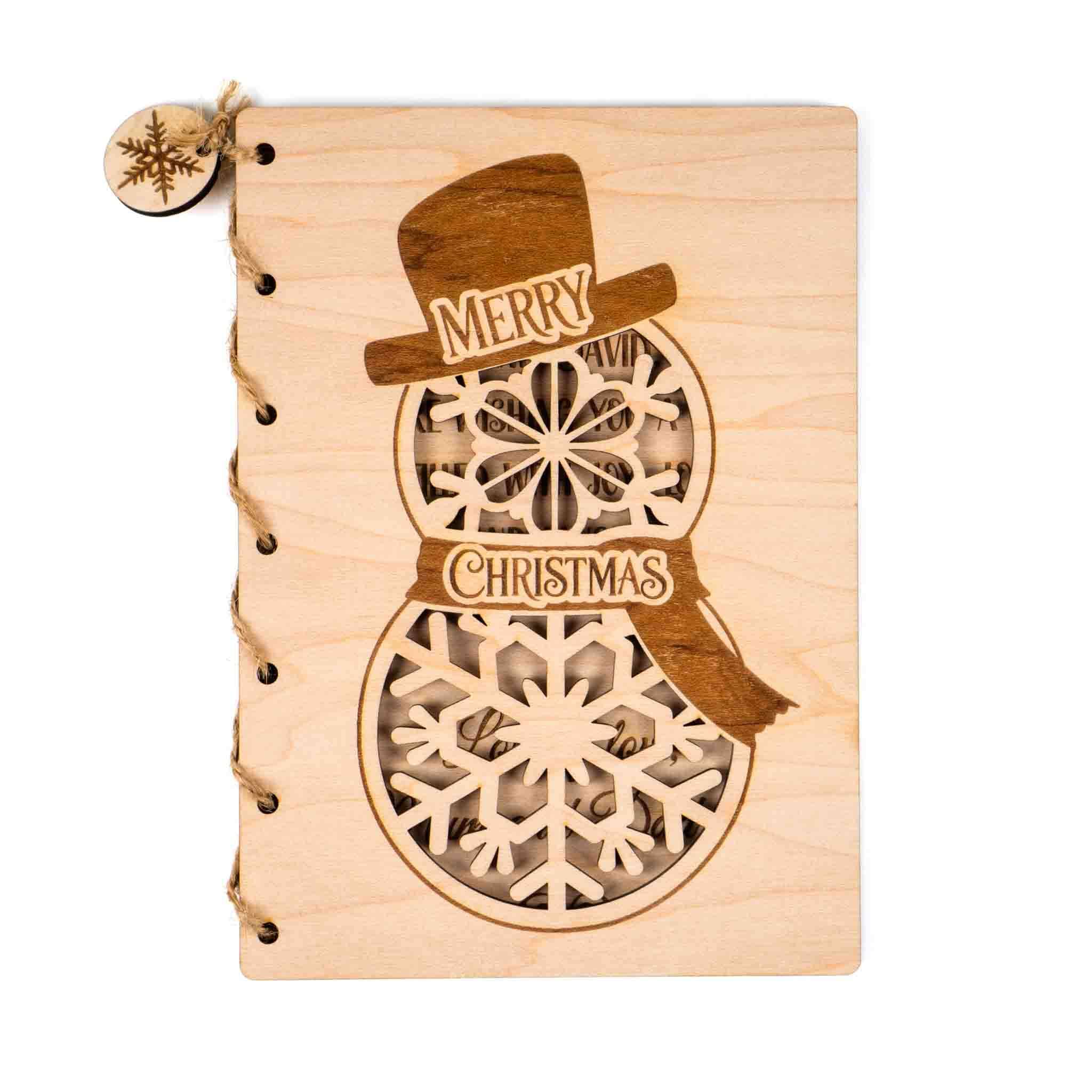 Personalised Christmas Card featuring an engraved snowman design with a cheerful message and intricate snowflake details.