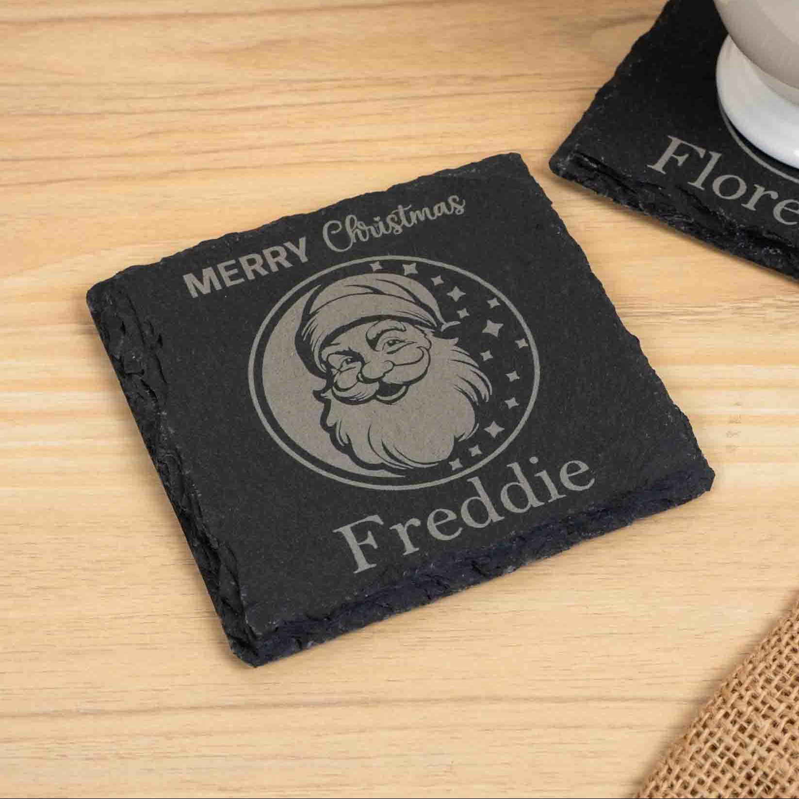 Personalised Christmas Coaster with engraved Santa design and the name Freddie.