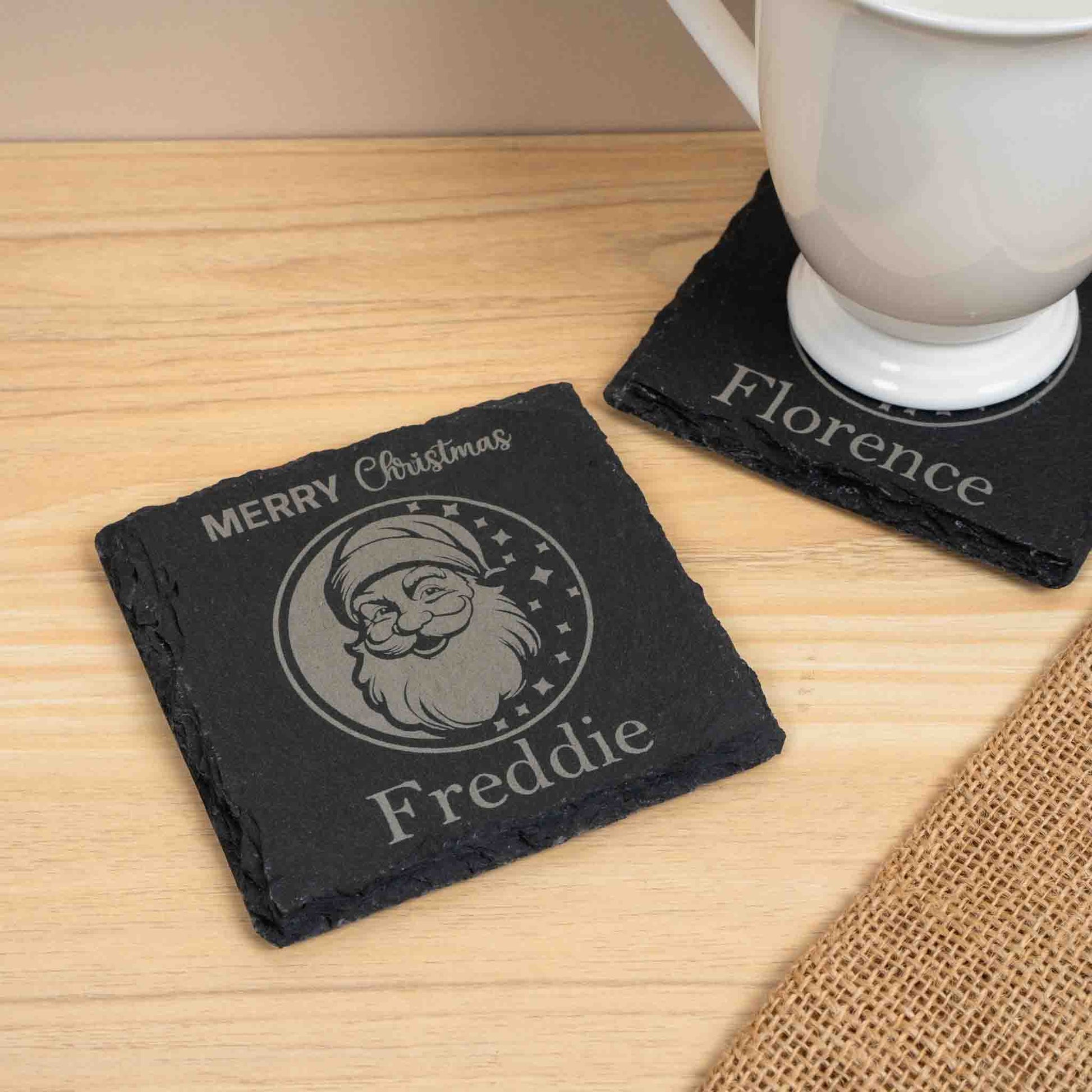 Personalised Christmas Coaster with engraved Santa design and the name Freddie.