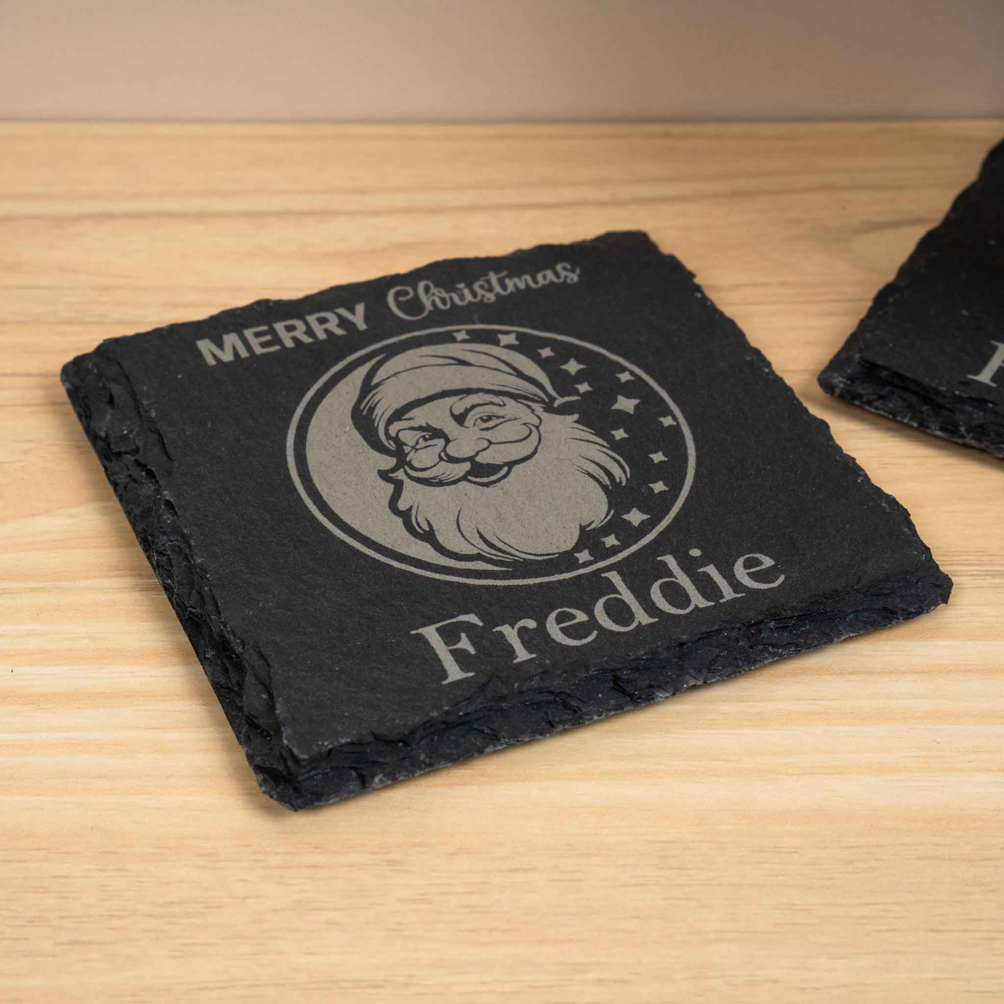 Personalised Christmas Coaster featuring an engraved Santa design and custom name, perfect for festive holiday decor.