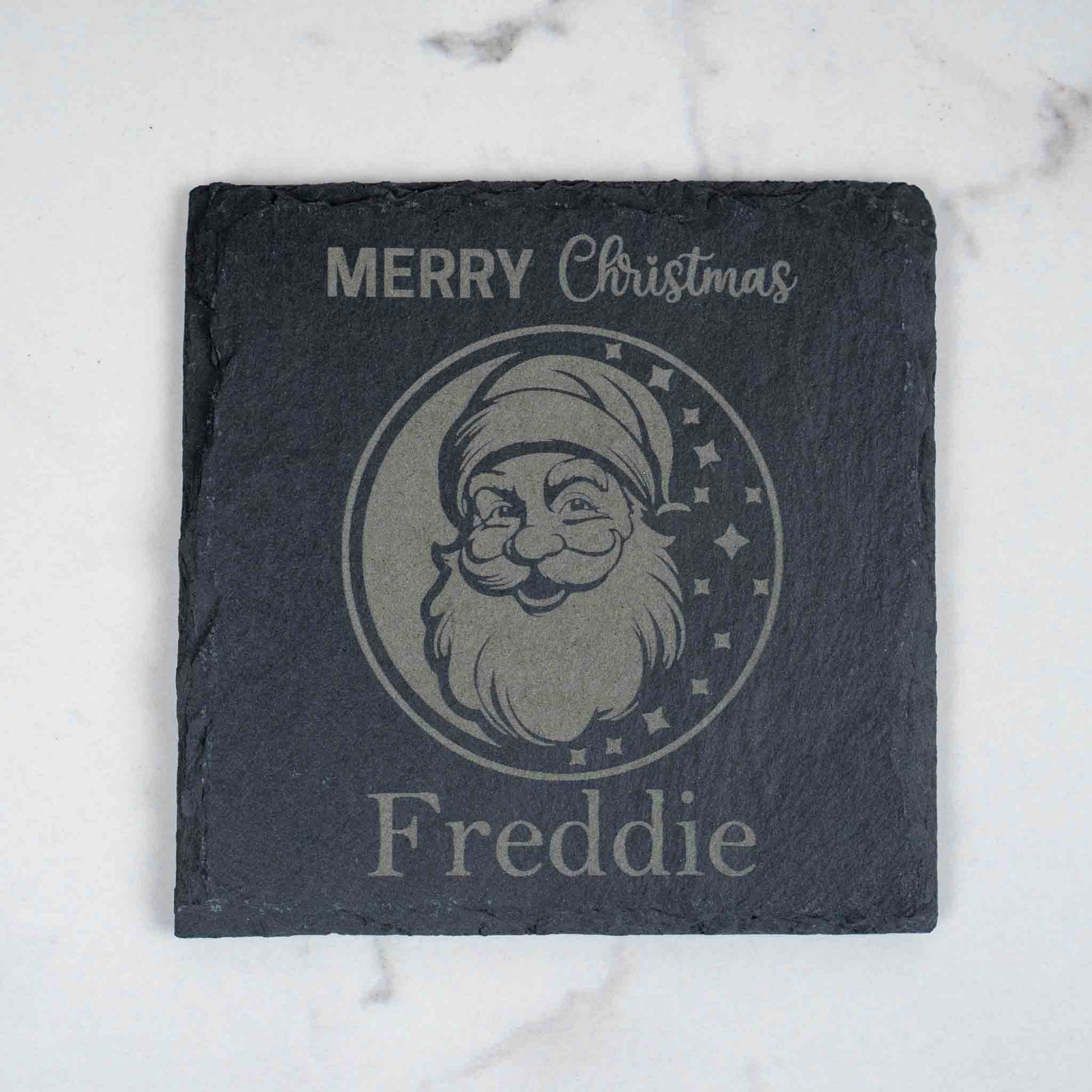 Personalised Christmas Coaster featuring engraved Santa design with Merry Christmas and Freddie text