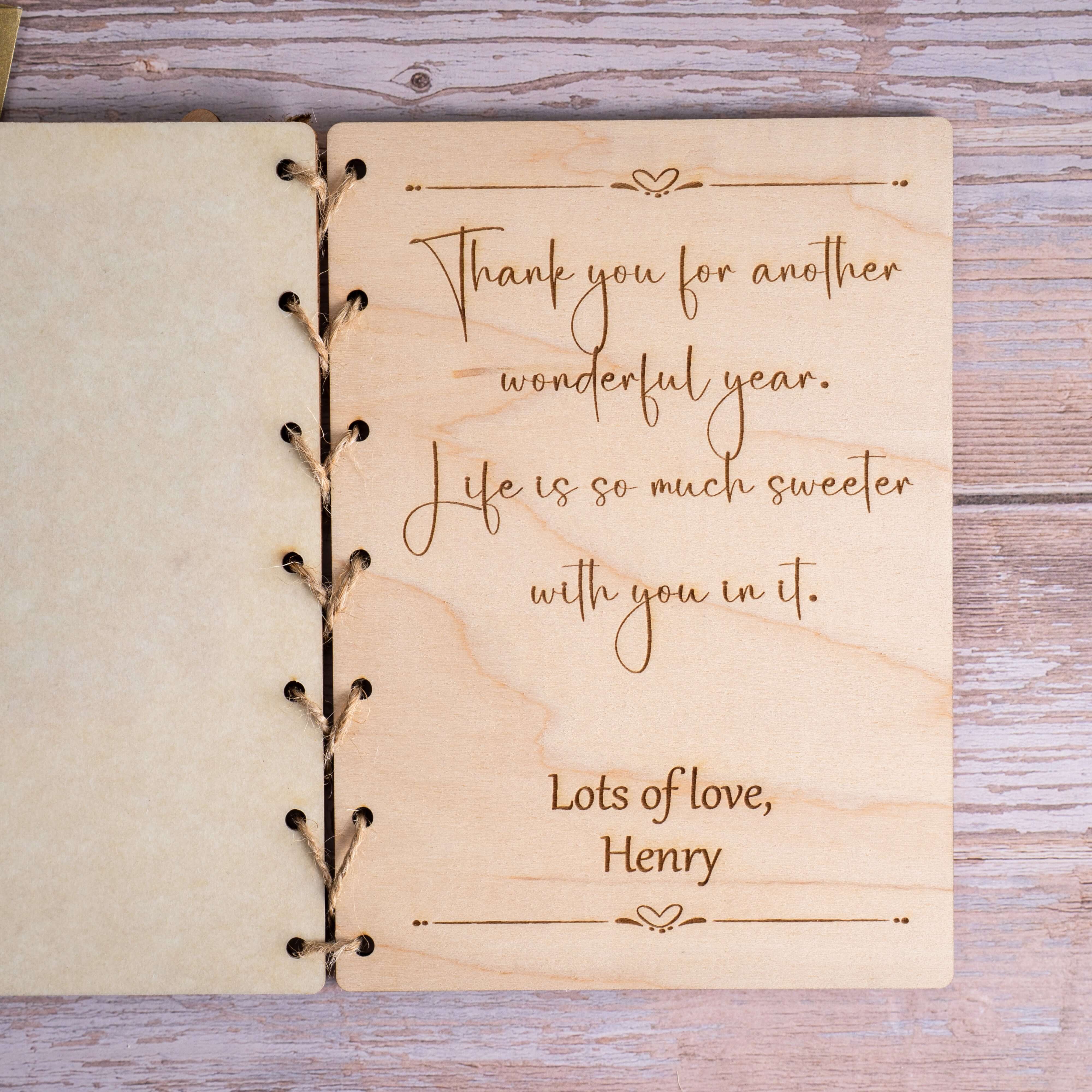 Interior of a personalized wooden card with heartfelt message, featuring the phrase 'Thank you for another wonderful year'.