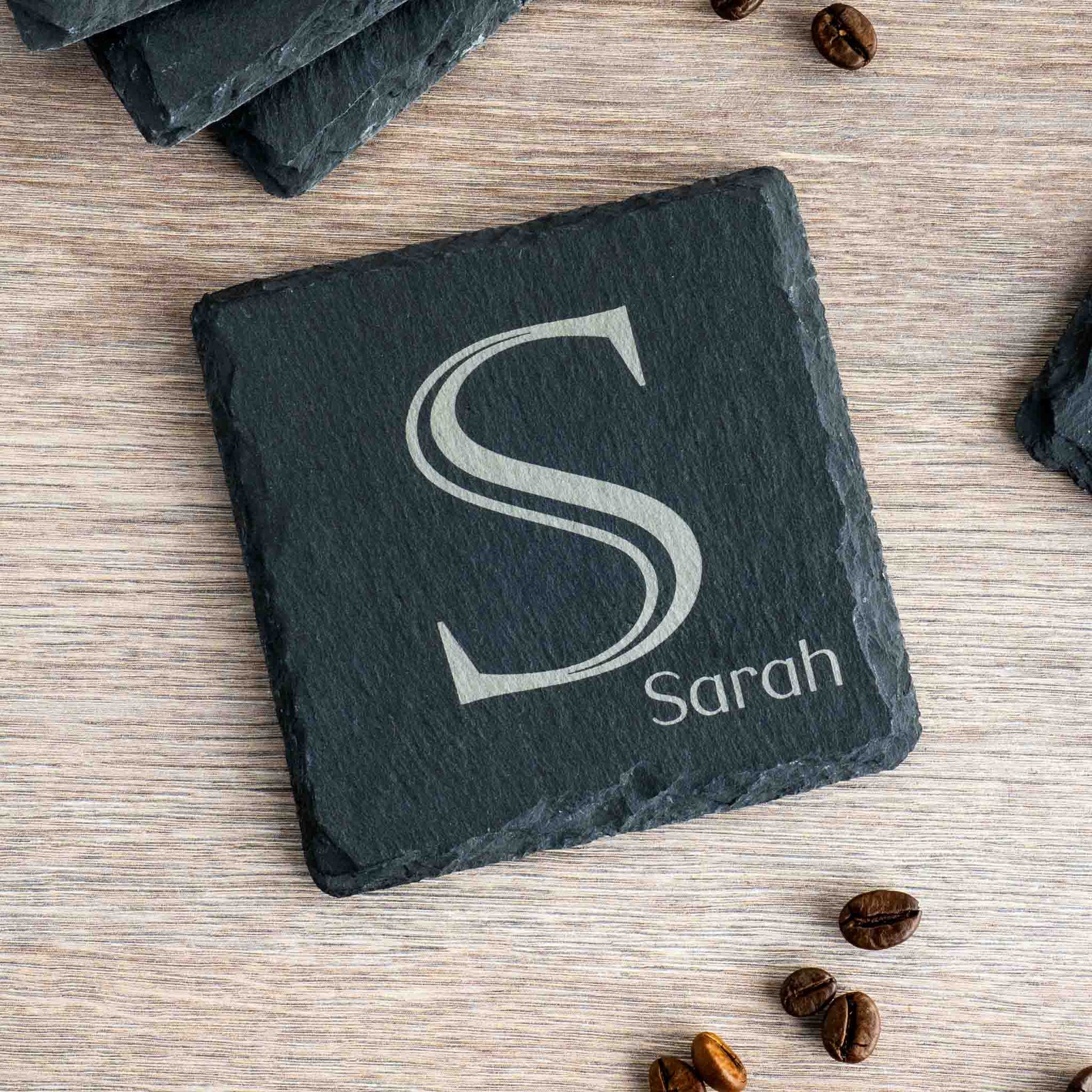 Personalised coaster with monogram 'S' and name 'Sarah' on slate, perfect for home decor or gifts.