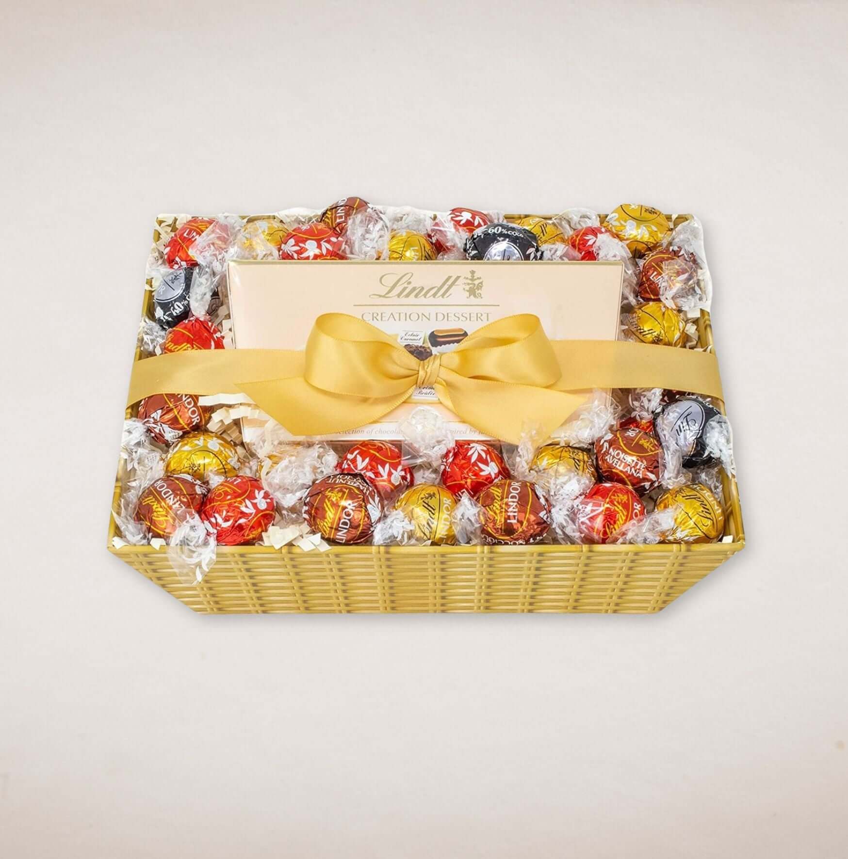 Lindt Chocolate Hamper featuring Creation Dessert and 36 assorted truffles in a decorative basket.