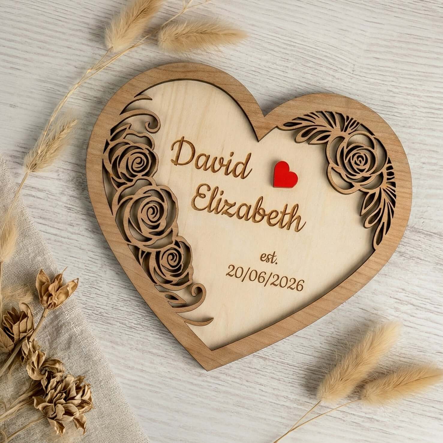 Personalised wooden heart plaque featuring names David and Elizabeth, established date 20/06/2026, decorative floral design.